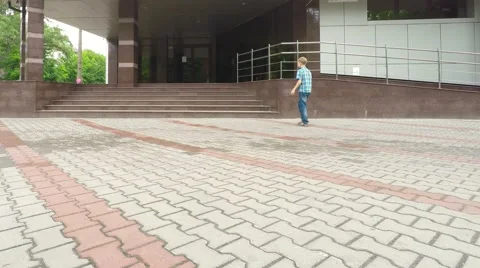 The boy is going around the city. Video stock 51585130