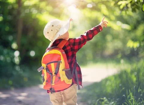 Boy going camping with backpack in nature Stock Photos