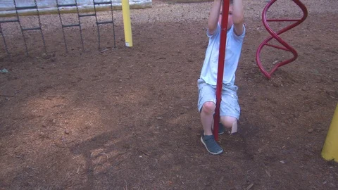 Boy Going Down Pole at a Park Stock Footage 91624104
