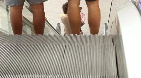 A boy going up on escalator stairway Stock Footage 20543882