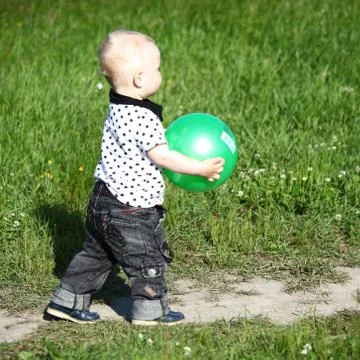 Boy in grass Фото