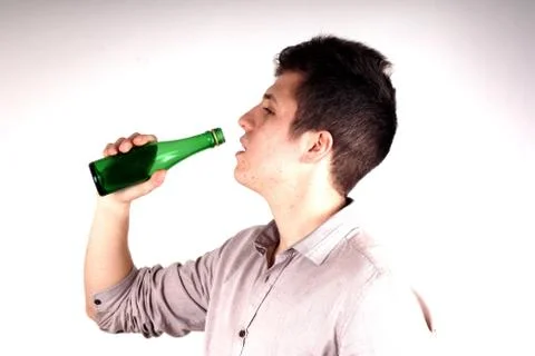 Boy with green bottle Stock Photos