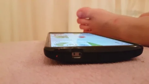 Boy hand playing on smartphone Stock Footage 80839535