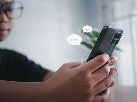 Boy hand using smartphone typing live chat chatting on application communic.. Stock Photos