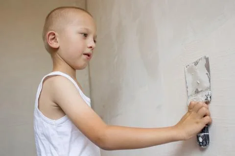 Boy hand using trowel Stock Photos