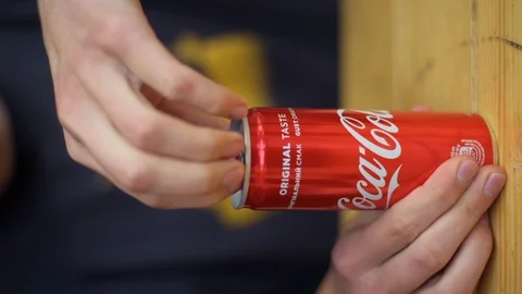 Boy hands opening a coca cola metallic can, vertical screen Stock Footage 112869280