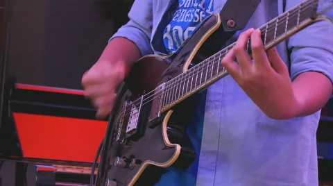 Boy hands playing guitar Stock Footage 53562353