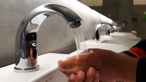Boy hands washing under running tap water Stock Footage 100323104