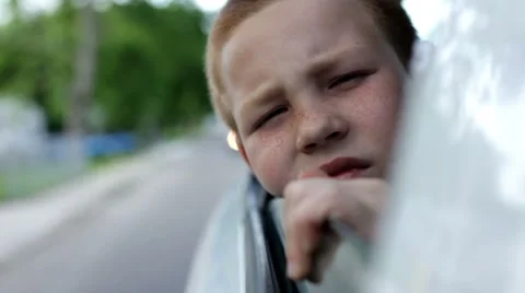 Boy hanging head out window Video stock 7925417