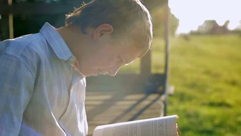 The boy is happy to have a book Stock Footage