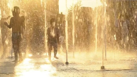 The boy is happy playing in the fountain. Slow shooting. Ukraine Kiev 2017 Stock Footage 78635548