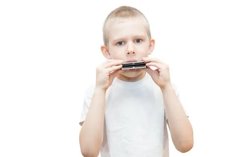 Boy with a harmonica Stock Photos
