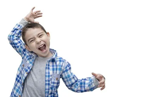 The boy has fun and makes faces like a monkey. Emotional child. Stock Photos