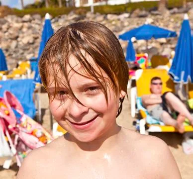 Boy has fun at the beach Stock Photos