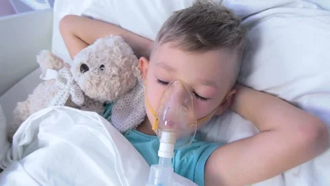 Boy has inhalation Video stock 145938258