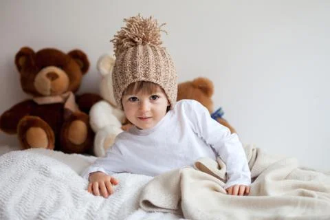 Boy with hat and teddy bears Stock Photos
