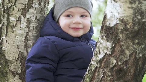 Boy in a hat on a birch 動画素材 132104324