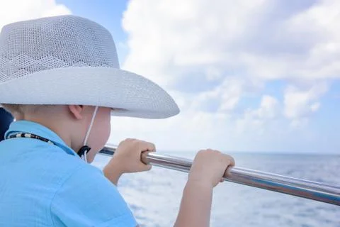 A boy in a hat on a yacht Stock Photos
