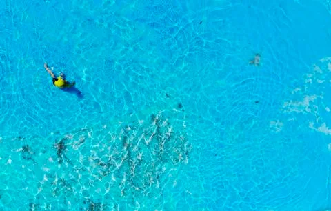 Boy having fun and playing in swimming pool Stock Photos