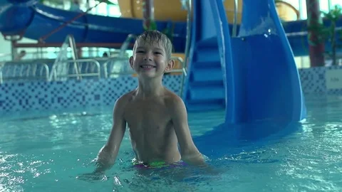 Boy having fun in aquapark in slow motion Stock Footage 81922889