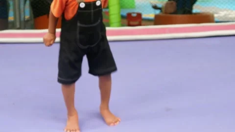 Boy is having fun jumping on a trampoline Stock-Footage 310244114