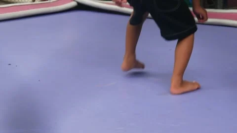 Boy is having fun jumping on a trampoline Stock Footage 310244118