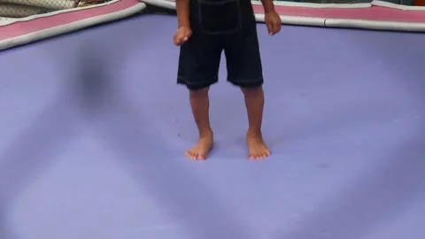 Boy is having fun jumping on a trampoline Stock Footage 310244119