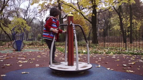 Boy having fun on playground in the park, steadycam, slow motion shot at 240fps Stock-Footage 44925555