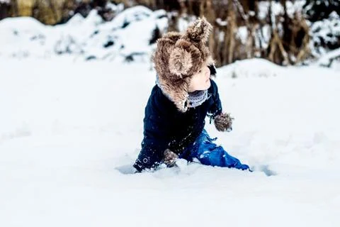 Boy having fun in the snow Stock Photos