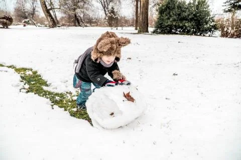 Boy having fun in the snow Stock Photos