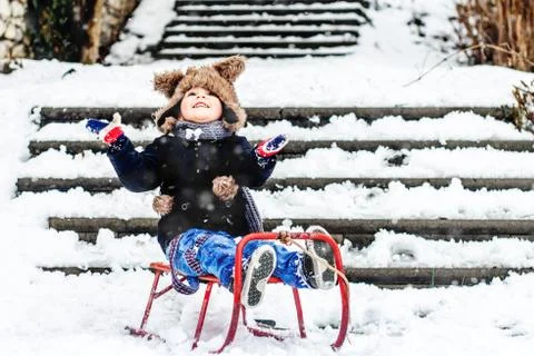 Boy having fun in the snow Stock Photos