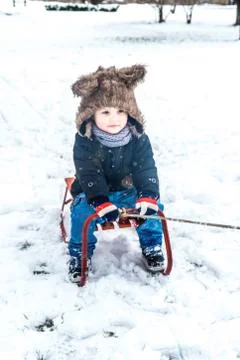 Boy having fun in the snow Stock Photos