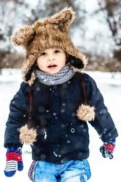 Boy having fun in the snow Stock Photos