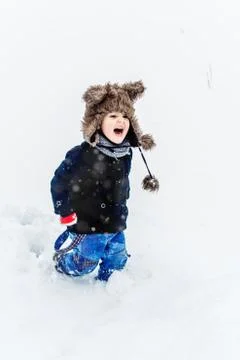Boy having fun in the snow Stock Photos