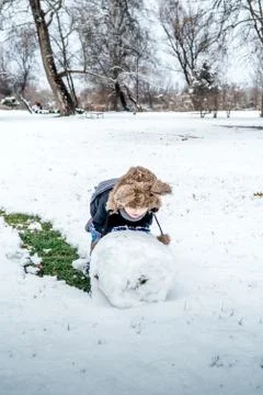 Boy having fun in the snow Stock Photos