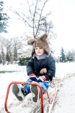Boy having fun in the snow Stock Photos