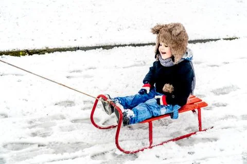 Boy having fun in the snow Stock Photos