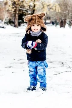 Boy having fun in the snow Stock Photos