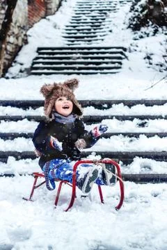 Boy having fun in the snow Stock Photos