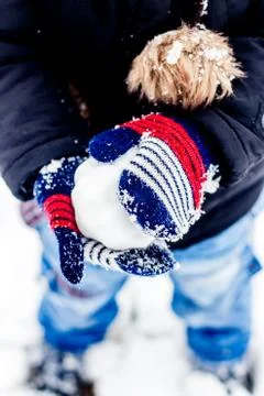 Boy having fun in the snow Stock Photos