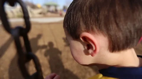 Boy having fun on swing Stock Footage 50123415