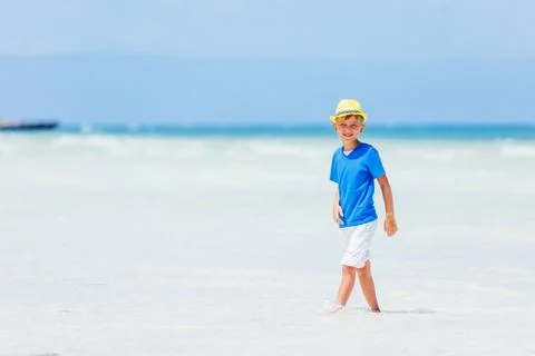 Boy having fun on tropical ocean beach. Kid during family sea vacation. Fotos Stock