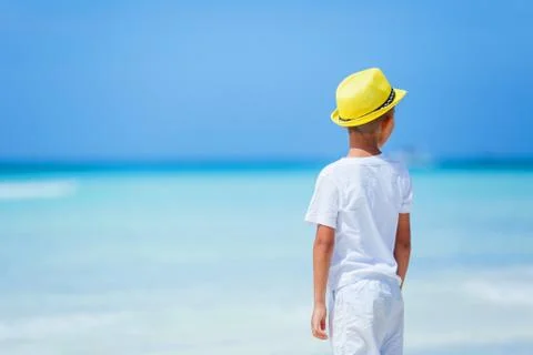 Boy having fun on tropical ocean beach. Kid during family sea vacation. 写真素材