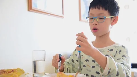 Boy having omlet for breakfast Stock Footage 69851415