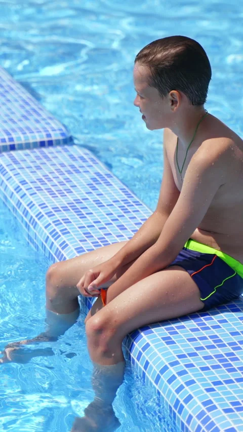 Boy having a rest in the pool Stock Footage 300791791