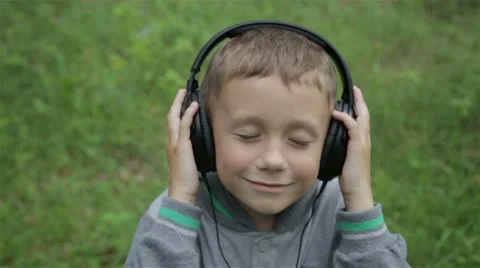 Boy with headphones Stock Footage 64529681