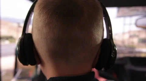 Boy in headphones playing computer games Stock Footage 62497332