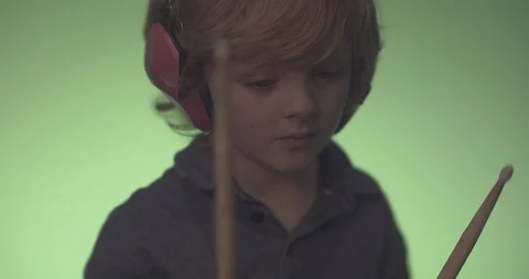 Boy with headphones playing drum sets Stock Footage 99991304