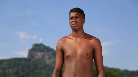 A boy heads a ball while standing in front of a mountain Video stock 67347111