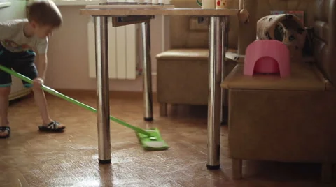 The boy helps parents to do housework Stock Footage 60594967